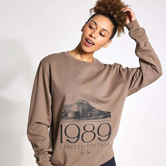 TayTay, Tay Tay 1989 Limited Edition Sweatshirt, 1989 Limited Edition Sweatshirt for the ultimate Swiftie. Models Height: 5'8" Model is wearing: Medium Material: 80% ringspun cotton/20% polyester. Drop shoulder style. Stylish fit. Soft cotton faced fabric