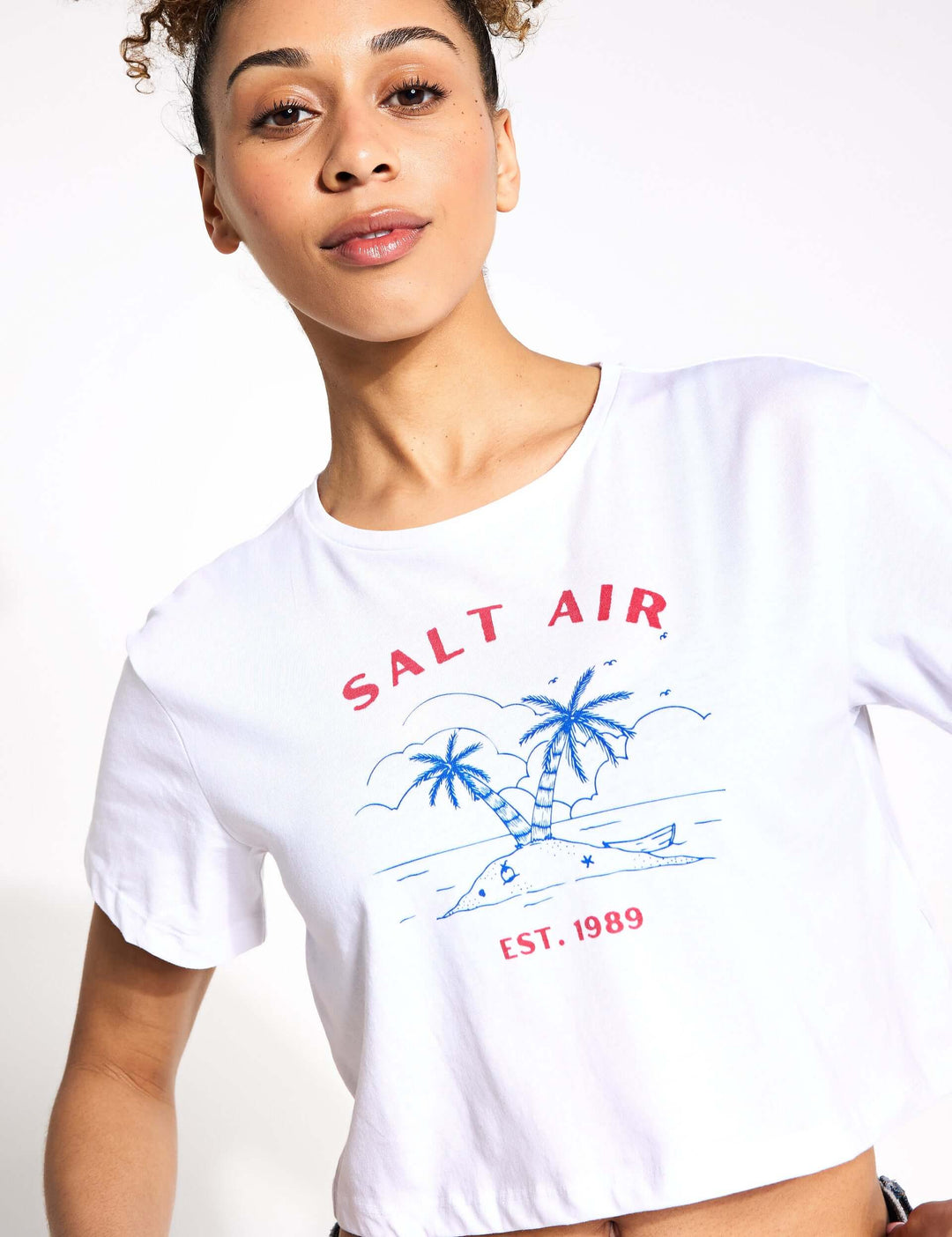 TayTay, Salt Air Palm Baby Tee, Inspired by the opening line from August on Folklore Models Height: 5'8" Model is wearing: X-Small Material:100% Cotton* Weight:150gsm Cropped t-shirt. Crew neck and short-sleeved. BSCI certified. SEDEX certified. WRAP cert